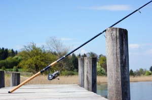 fishing rod on a waterway boardwalk